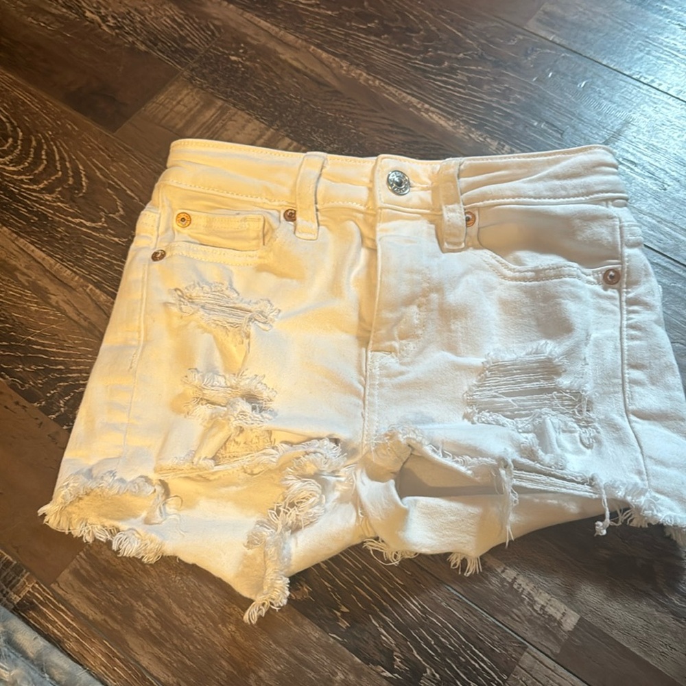 American Eagle white ripped jeans shorts.  Size 000.